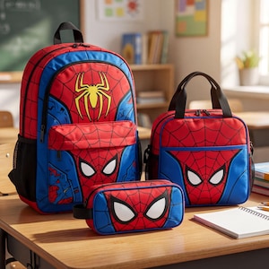 A Spiderman-themed backpack, a lunch bag, and a pencil case are displayed on a wooden desk in a classroom setting.