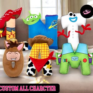 A collection of plush toys representing characters from the Toy Story franchise, including Woody, Buzz Lightyear, and other beloved characters.
