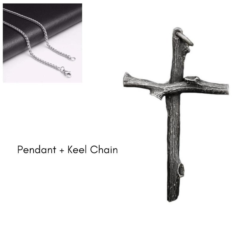 May include: A silver-colored chain necklace with a cross pendant. The cross pendant has a rustic, textured appearance, resembling a wooden branch. The text "Pendant + Keel Chain" is displayed below the chain.