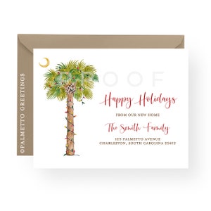 May include: A Christmas card featuring a watercolor illustration of a palm tree decorated with Christmas lights. The text "OOF Happy Holidays" is written in cursive above the tree. The text "From our new home The Smith Family 123 Palmetto Avenue Charleston, South Carolina 29412" is written below the tree.