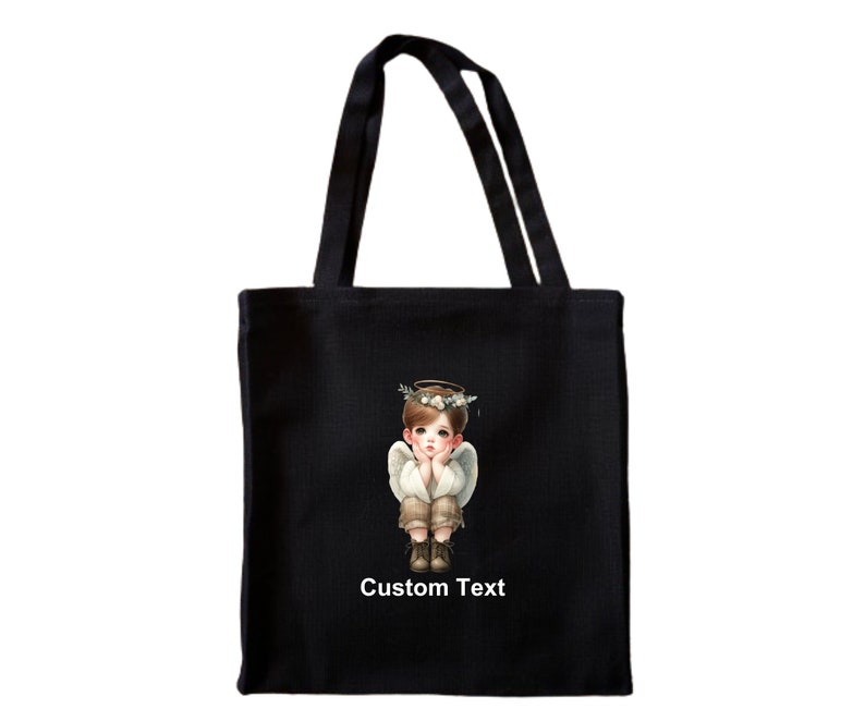 May include: Black tote bag with a white angel illustration and the text "Custom Text".