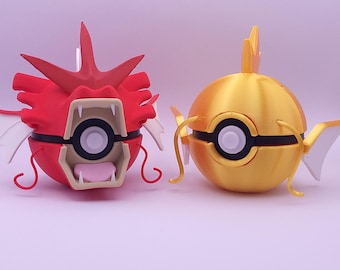 Könnte beinhalten: Zwei 3D-gedruckte Figuren von Pokémon-Charakteren. Eine ist rot mit weißen Akzenten und einem bedrohlichen Ausdruck. Die andere ist goldgelb mit schwarzen und weißen Details. Beide haben kreisförmige Augendesigns und sind vor einem hellvioletten Hintergrund.