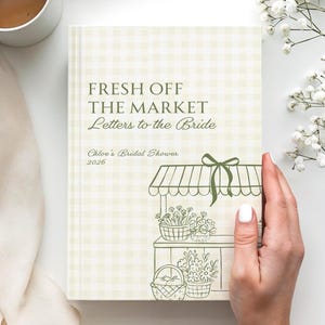 May include: A rectangular book with a light green and white gingham pattern cover. The text reads FRESH OFF THE MARKET Letters to the Bride Chloe's Bridal Shower 2026. A green line drawing of a market stall with flowers and baskets is below.
