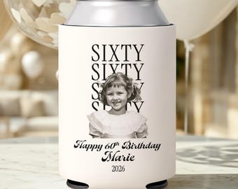 May include: A light-colored foam can cooler featuring a black and white photograph of a young child. The text reads SIXTY SIXTY SIXTY, Happy 60th Birthday, Marie, and 2026. The design is printed on a cylindrical sleeve intended for beverage cans.