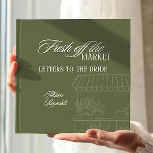 May include: A square olive green book with white text that reads Fresh off the MARKET LETTERS TO THE BRIDE and Allison Reynolds. The cover features a white line drawing of a market stall with baskets of flowers and produce on the front.