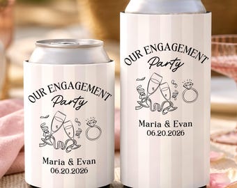 May include: Two white and light pink striped can coolers featuring black text that reads OUR ENGAGEMENT Party, Maria & Evan, and 06.20.2026. The design includes black line art illustrations of two clinking champagne flutes and a diamond ring.