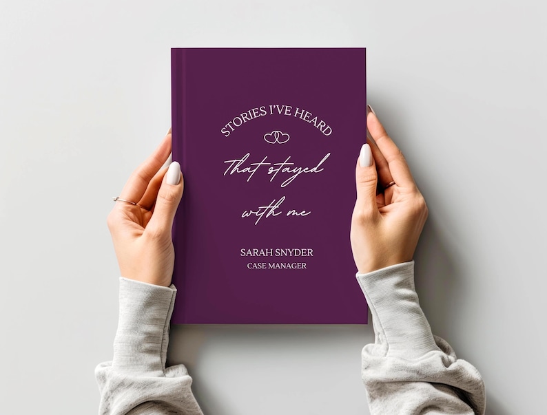 A5 hardcover lined journal shown by a model in the color "mulberry."
