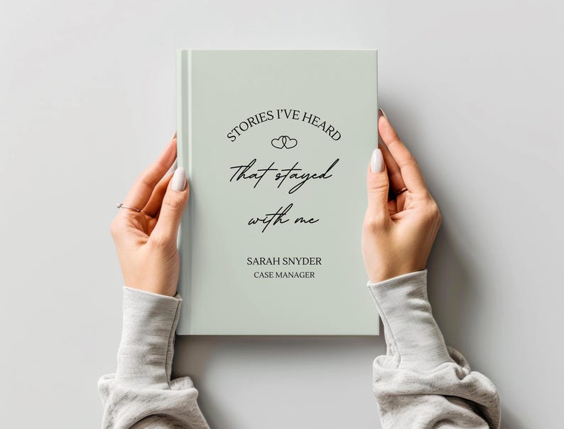 A5 hardcover lined journal shown by a model in the color "sage."