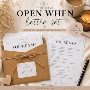 May include: A printable "Open When Letter Set" with a kraft paper envelope tied with twine, containing cards that read "Open When You're Sad." The set includes a printed letter and a pen, with a candle and a mug in the background.