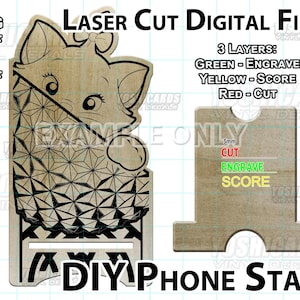 May include: Laser-cut digital file for a DIY phone stand. The design features a cat with a bow, geometric patterns, and the text "DIY Phone Stand". The file includes SVG, DXF, AI, and PDF formats. The stand is made of wood and has three layers: engrave, score, and cut.