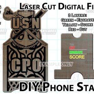 May include: Digital laser cut files for a DIY phone stand. The design features the letters "USN" and "CPO" with crossed swords and an anchor. The image also shows a stand with instructions for cutting, engraving, and scoring.