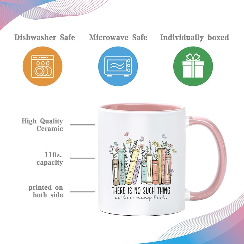 May include: White ceramic mug with a pink interior and handle, featuring a colorful illustration of books and flowers. The mug has a capacity of 11 oz and the text "THERE IS NO SUCH THING as too many books."