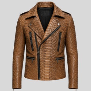 May include: A brown motorcycle jacket featuring a textured snakeskin pattern throughout. The jacket includes a wide collar, an asymmetrical front zipper closure, and four zippered pockets on the front. The interior is lined with black fabric.