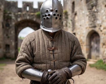 May include: A polished steel knight helmet with a rounded top and multiple circular ventilation holes, worn over a tan quilted gambeson jacket with brown leather toggle closures, paired with steel forearm bracers and dark brown leather gloves.