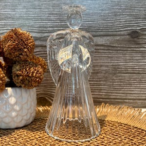 Vintage clear glass angel candle holder - decorative candlestick with halo and textured wings - elegant retro item