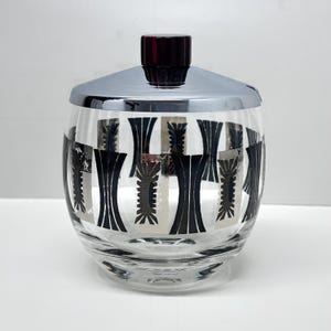 May include: A rustic wooden sign with the text "Welcome to our home" in white lettering. The sign features a distressed finish and a simple, inviting design, perfect for entryway decor.