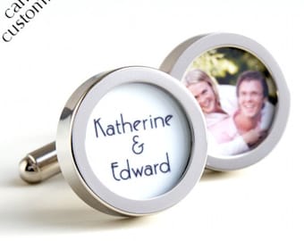 May include: Silver cufflinks with a circular design. One cufflink features a photo of a couple, while the other displays the names "Katherine & Edward" in blue script. The text "I can be customized" is in the upper left corner.
