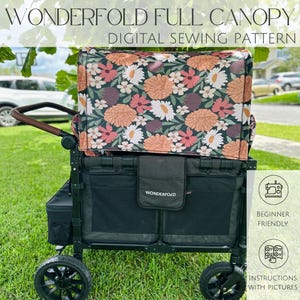 Può includere: Un carrello nero con una capottina floreale con fiori arancioni, rosa e bianchi su uno sfondo verde scuro. Il carrello ha ruote nere e un manico marrone. Il testo sulla capottina recita "WONDERFOLD FULL CANOPY DIGITAL SEWING PATTERN".