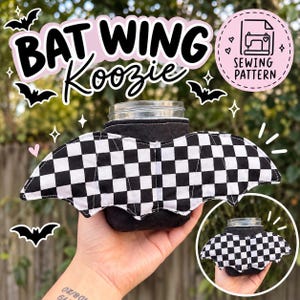 May include: A black quilted fabric koozie featuring large, attached bat wings with a black and white checkered pattern. The text BAT WING Koozie and SEWING PATTERN are visible. The koozie is designed to wrap around a glass jar for insulation.