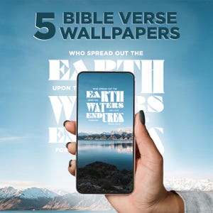 May include: A smartphone displaying a Bible verse wallpaper with a landscape scene of a lake and mountains. The phone is held against a blue sky background with the text "5 BIBLE VERSE WALLPAPERS". The wallpaper text reads "WHO SPREAD OUT THE EARTH UPON THE WATERS ENDURES HIS LOVE FOREVER".
