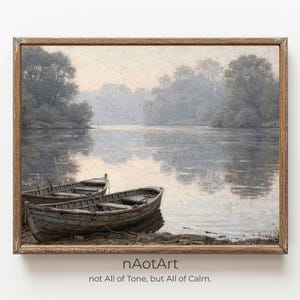 May include: A framed print of a serene landscape featuring two weathered rowboats resting on the shore of a calm lake. The artwork is rendered in muted tones of gray, brown, and blue, with a hazy atmosphere and trees in the background. The text "nAotArt not All of Tone, but All of Calm" is at the bottom.