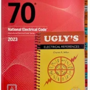 May include: A red and yellow book set featuring "NFPA 70 National Electrical Code 2023" and "UGLY'S ELECTRICAL REFERENCES 2023 EDITION". The books have spiral binding and include a diagram of electrical symbols.