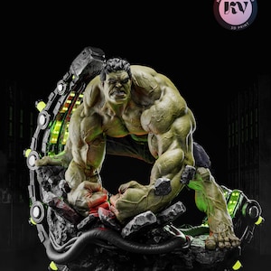 May include: A green Hulk statue in a dynamic pose, with detailed musculature and a fierce expression. The figure is set against a dark background, with a futuristic, glowing green and black structure behind it. The base is a rocky, textured surface. The text "Kyle Verse Studio" is visible.