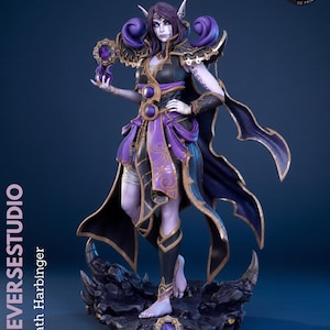 May include: A 3D printed figurine of Xal'atath Harbinger featuring a pale-skinned character with purple hair, pointed ears, and dark markings. The figure wears black and purple armour with gold trim, holds a glowing orb, and stands on a rocky base.