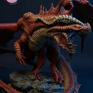 May include: A detailed 3D-printed dragon figurine in shades of red, with textured scales and open mouth. The dragon has large wings and is posed on a rocky base. The logo "KYLE VERSE STUDIO 3D PRINT" is visible in the upper left corner.