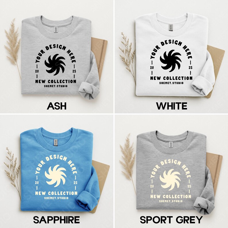 Puede incluir: Cuatro sudaderas de cuello redondo en ceniza, blanco, zafiro y gris deportivo. Cada sudadera presenta un dise&ntilde;o circular con el texto "YOUR DESIGN HERE" y "NEW COLLECTION SHEMET.STUDIO". Las sudaderas se muestran sobre un fondo neutro.