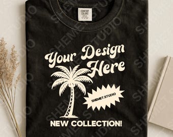 May include: Black t-shirt with a white palm tree graphic and the text "Your Design Here" and "New Collection!". The shirt also features the text "SHEMET.STUDIO".