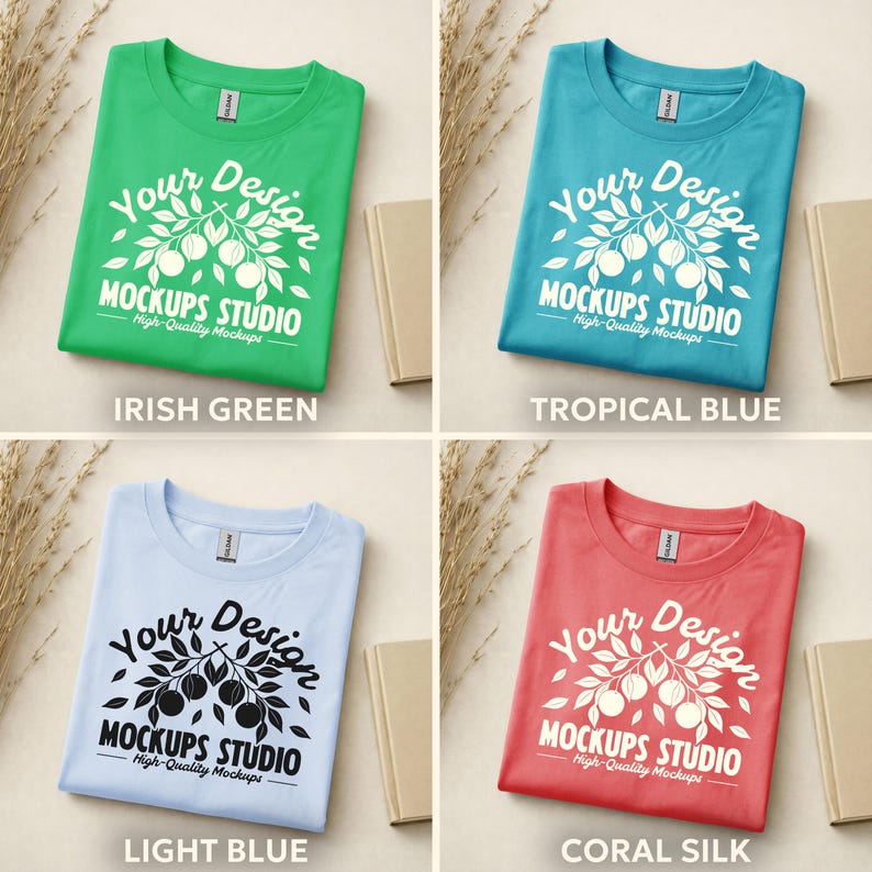 May include: Four folded t-shirts in different colors: Irish Green, Tropical Blue, Light Blue, and Coral Silk. Each shirt has a white graphic design with the text "Your Design MOCKUPS STUDIO High-Quality Mockups".