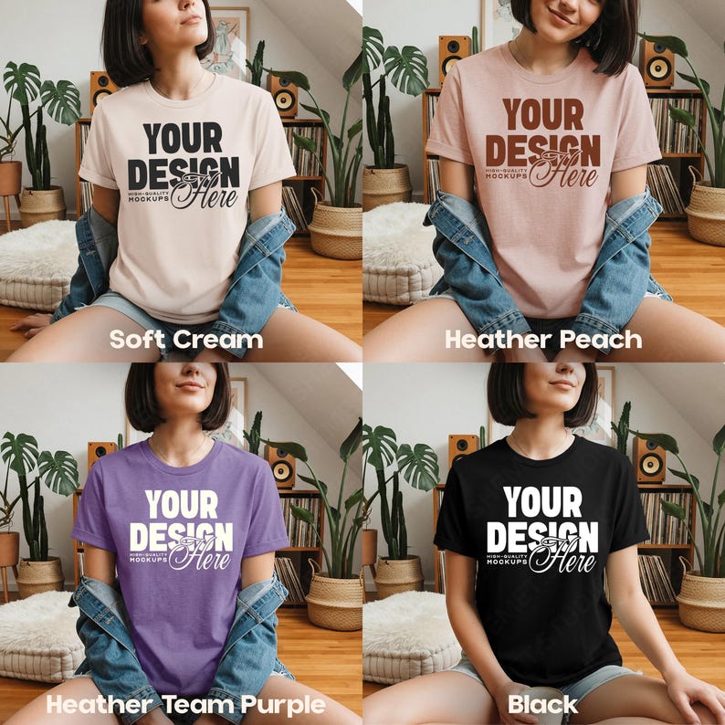 May include: Four t-shirts in different colors: soft cream, heather peach, heather team purple, and black. Each shirt has the text "YOUR DESIGN Here" in a contrasting color. The shirts are short-sleeved.