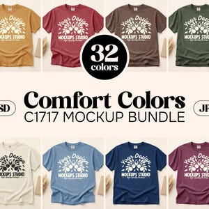 May include: A mockup bundle of Comfort Colors C1717 t-shirts in various colors, including mustard yellow, burgundy, and navy blue. Each shirt features a white graphic and the text "Your Design MOCKUPS STUDIO". The image also includes the text "32 colors", "PSD", and "JPG".