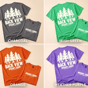 May include: Four t-shirts in different colors: charcoal, Irish green, orange, and heather purple. Each shirt has a white graphic of trees and the text "BACK VIEW" and "MOCKUPS STUDIO". Each shirt is paired with a smaller folded shirt of the same color.