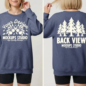 May include: A blue sweatshirt with white text and graphics. The front features the words "Your Design" above a branch design with fruit, and "MOCKUPS STUDIO" below. The back displays a tree graphic and the words "BACK VIEW" and "MOCKUPS STUDIO".