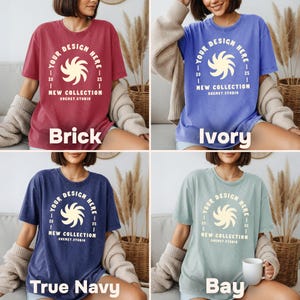 May include: Four t-shirts in brick, ivory, true navy, and bay colors. Each shirt features a circular design with the text "YOUR DESIGN HERE" and "NEW COLLECTION SHEMET.STUDIO". The shirts are displayed on a person.