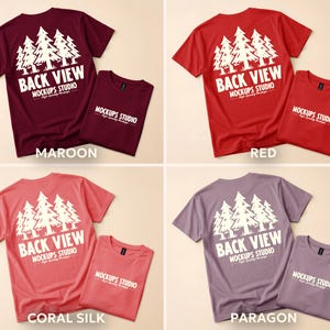 May include: A collection of short-sleeved t-shirts in various colors: maroon, red, coral silk, and paragon. Each shirt features a white graphic of pine trees and the text "BACK VIEW MOCKUPS STUDIO". A smaller, folded shirt of the same color is next to each.