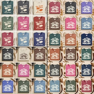 May include: A collection of various-colored t-shirts, each featuring a unique design. Some shirts display a palm tree graphic with the text "Your Design Here" and "New Collection." Others have a floral design with "Mockups Studio."