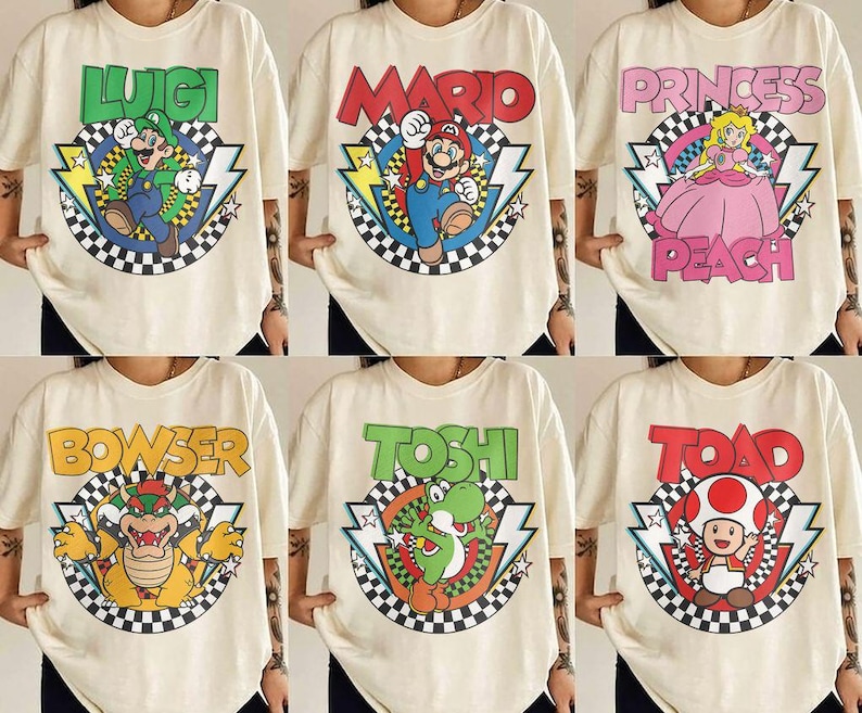 May include: A collection of six off-white t-shirts featuring graphic prints of Nintendo characters including Luigi, Mario, Princess Peach, Bowser, Yoshi, and Toad. Each shirt displays the character name, a checkered circle, and lightning bolts.