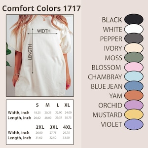 Puede incluir: Vestido camiseta Comfort Colors 1717 color crema con mangas cortas. La imagen incluye una tabla de tallas con medidas en pulgadas y una paleta de colores con negro, blanco y otros tonos. El vestido est&aacute; disponible en tallas S a 4XL.