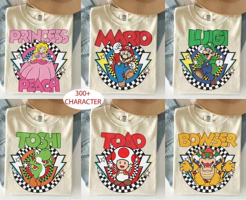 May include: Six cream-colored t-shirts featuring Nintendo characters Princess Peach, Mario, Luigi, Yoshi, Toad, and Bowser. Each shirt displays the character name in bold letters above a circular checkered graphic with lightning bolts and stars.