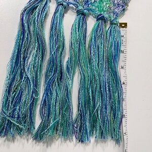 Lacy lightweight womens scarf in aqua/blue/green.  Bundles of fringe on both ends.