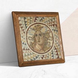 May include: A framed mosaic art piece featuring a classical female figure with wings, set within a circular border. The mosaic uses small, colorful tiles to create the image. The wooden frame adds a rustic touch to the artwork.