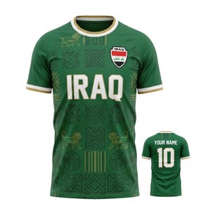 May include: Green soccer jersey with the word "IRAQ" in white block letters. The jersey features a geometric pattern, lion graphics, and the Iraqi flag. The back of the jersey has the number 10 and space for a name.
