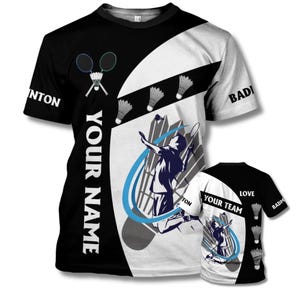 May include: Black and white badminton t-shirt with a graphic of a player jumping to hit a shuttlecock. The shirt has the words "YOUR NAME" and "BADMINTON" printed on it. A smaller version of the shirt is also visible.
