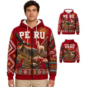 May include: A red zip-up hoodie featuring a white sherpa lining, a hood with drawstrings, and a graphic print of Peru with a condor, a llama, mountains, and a sun. The back displays the text 'YOUR NAME PERU' above a similar landscape design.