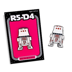 May include: A white and orange R5-D4 pin with a matching card. The card has a pink background with the text "R5-D4" and "May the 4th Edition". The pin is approximately 1.5 inches tall.