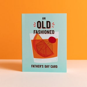 May include: A blue card with the text "An Old Fashioned Father's Day Card" and a cartoon illustration of an old fashioned cocktail.