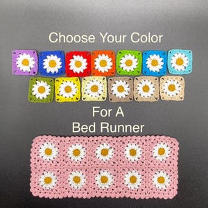 May include: A selection of crochet daisy squares in various colors, including purple, blue, red, orange, green, and pink. The text "Choose Your Color For A Bed Runner" is displayed above a pink bed runner with daisy motifs.